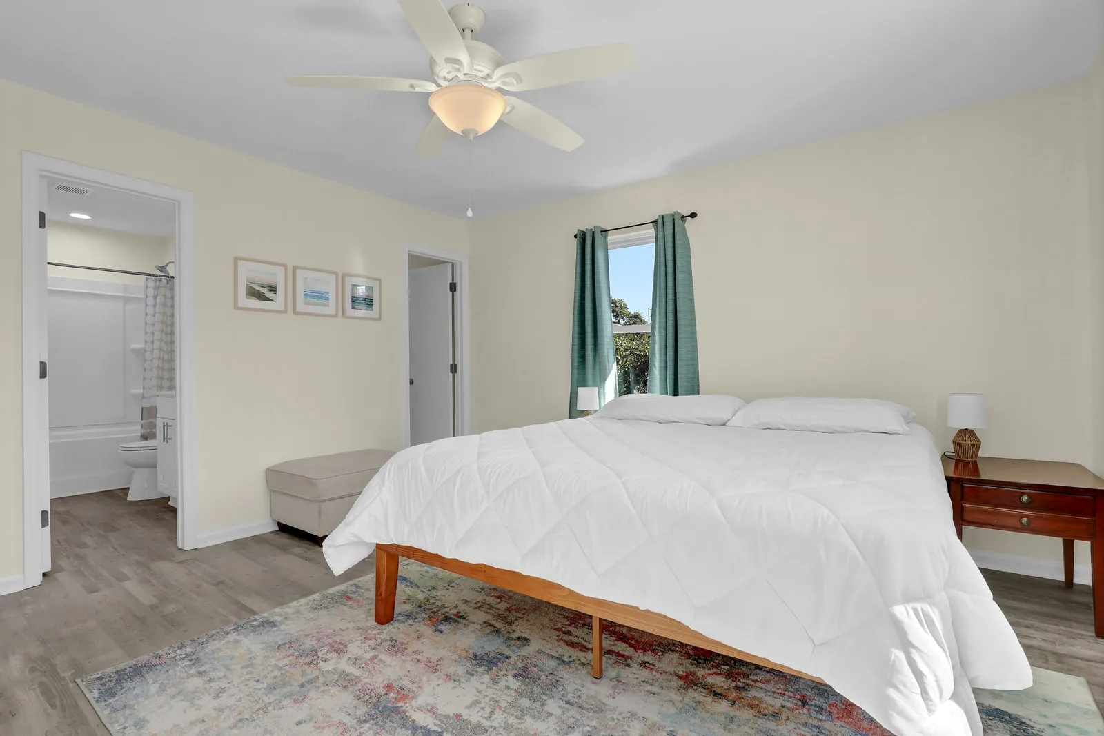 Bright bedroom with a comfortable queen bed